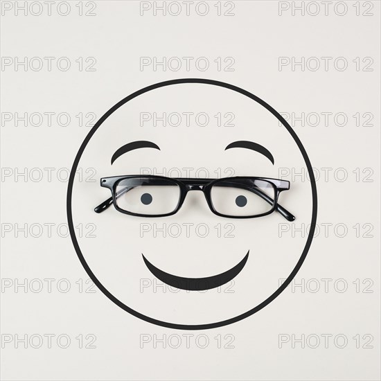 Head with a smiling face and eyeglasses, mental health concept, positive mindset, support and