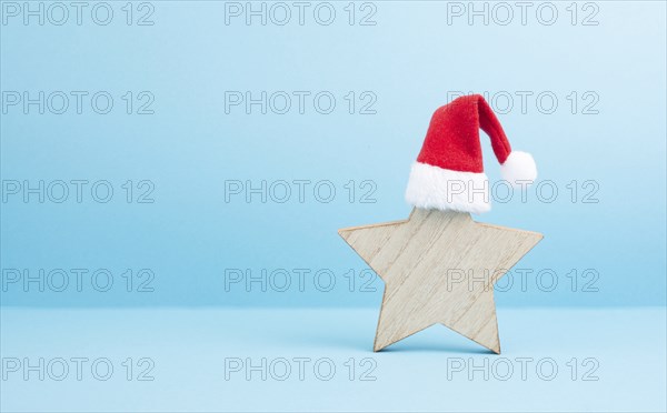 Star with a red christmas hat, winter greeting card and banner, copy space