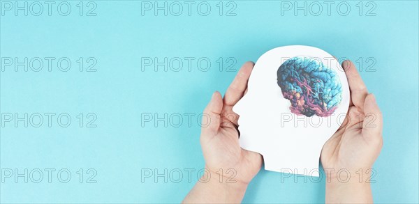 Holding a head with a brain in the hands, Parkinson disease, Alzheimer awardness, mental disorder