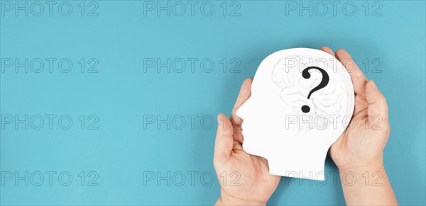 Head with a brain and question mark, education and business concept, searching for answers,