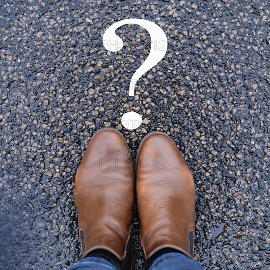Woman is thinking, question mark on the road, brainstorming and looking for answers, solving a