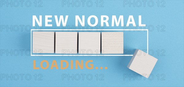 The words new normal are standing next to the loading bar, old and new life, time for a change