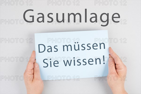 Gas commission is standing in german language on the paper, new fee regualtion in Germany, risk for