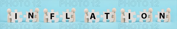 Men holding the letters for the word inflation, financial crash, economy development and increasing