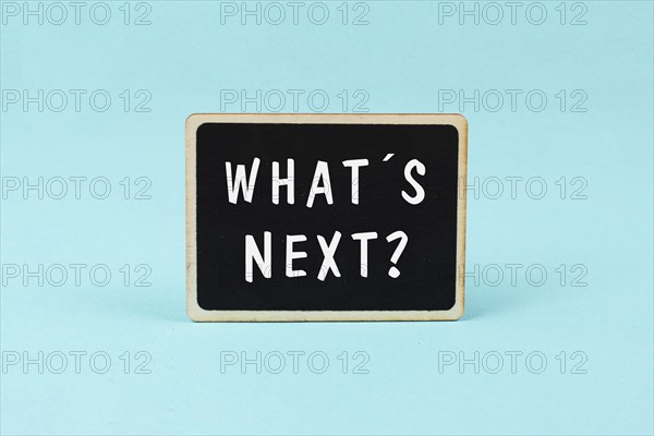 The phrase whatÂ´s next is standing on a chalkboard, having new goals and strategies, making plans