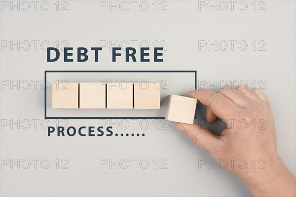 The words debt free in process are standing next to the loading bar, ending credit payments and