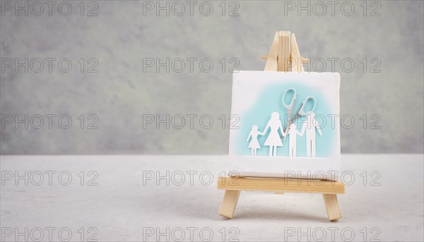 Divored parents, custody battle for the children, scissors cut the family, paper cut out, conflict