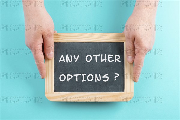 The phrase any other options is standing on a chalkboard, education, business and coaching concept,