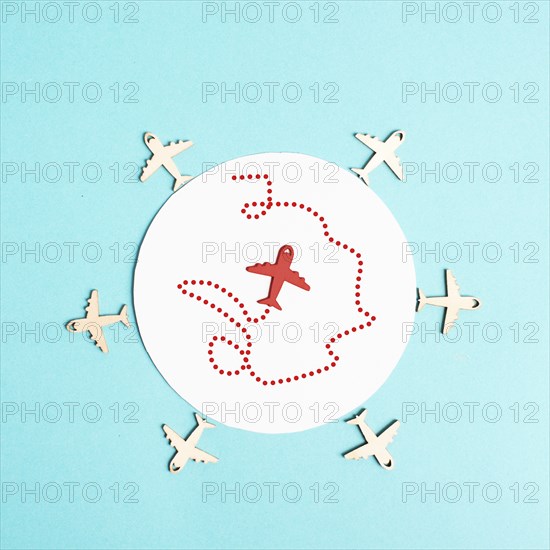Red airplane in the middle tries to find an exit, searching for freedom, think outside the box, be