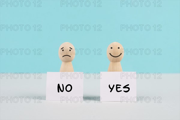 Men holding signs with the words yes and no, communication between people, business and education
