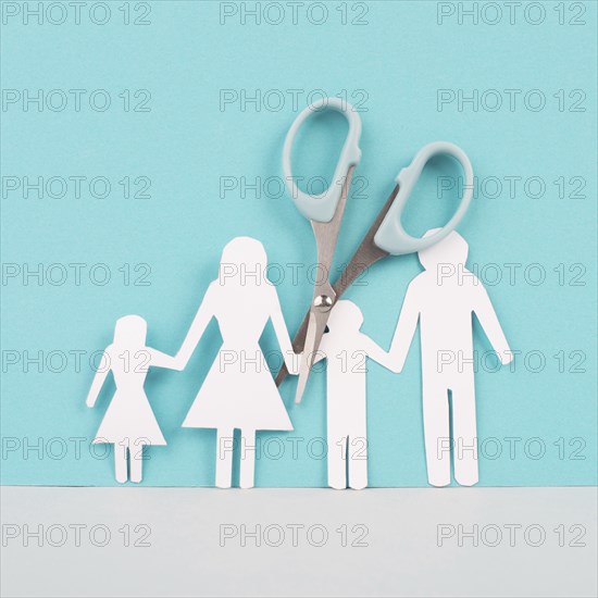 Divored parents, custody battle for the children, scissors cut the family, paper cut out, conflict