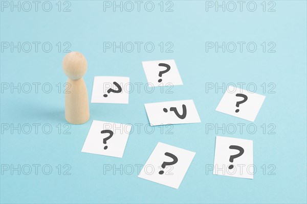 Man is thinking, question marks, brainstorming and looking for answers, solving a problem, making a
