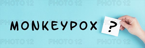 The word monkeypox is standing on a paper, outbreak of the MPXV virus, infectious disease spreading