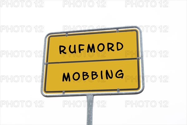 Sign with the words mobbing and character assassination in german language, cancel culture, social