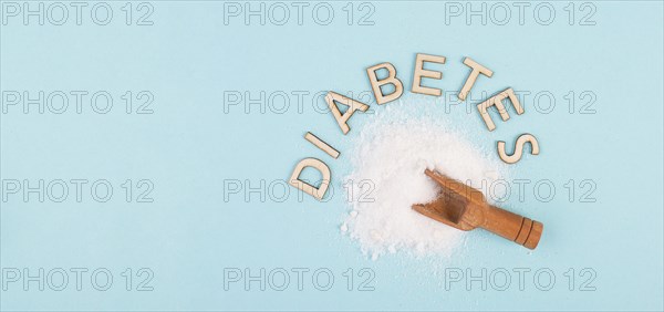 Shovel with white refined sugar, health problems by diabetes, insulin resistent, unhealthy food,
