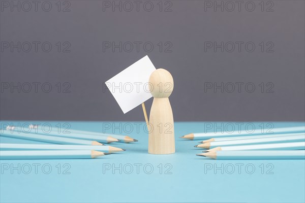 Man with an empty sign, blue pencils point to the person, business and education concept, cancel