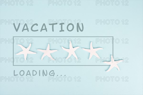 Progress bar with sea stars, vacation loading ist standing on the paper, planning a trip for the