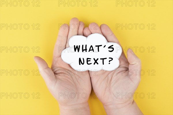 The phrase whatÂ´s next is standing on a cloud shaped paper, having new goals and strategies,