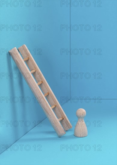 Man is standing next to a ladder, climbing up in career, having a goal, brainstorming for ideas,
