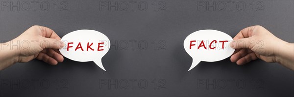 The words fact and fake are standing on a speech bubble, false and true information, media concept
