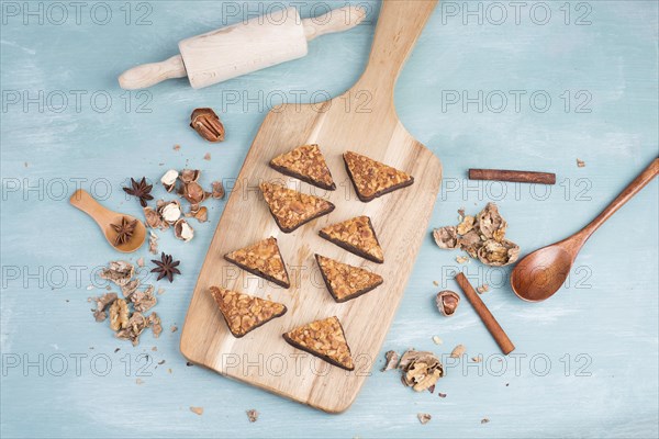 Nut corner, traditional german sweets called Nussecke, covered with chocolate, christmas baking