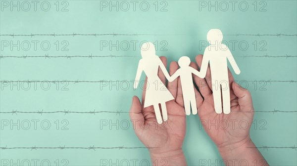 Immigration, refugees from Ukraine, asylem seekers, immigrants, silhouette of a family behind a