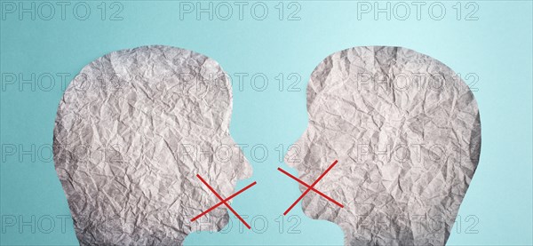 Two silhouette faces look at each other, red cross over his mouth, censorship free speech, cancel