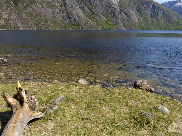 Lake with clear water, surrounded by rocks and mountain landscapes, Eidfjörd, Norway, Scandinavia,