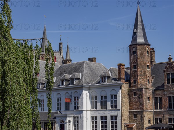 Historic city centre with characteristic architectural towers and brick buildings under a clear