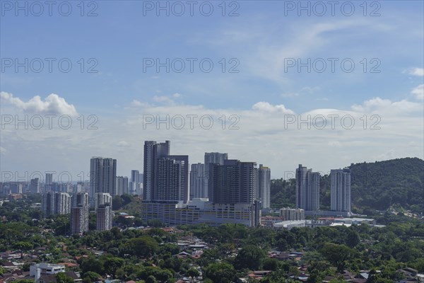 Modern cityscape with tall skyscrapers under a sky with light clouds, Pattaya, Thailand, Asia