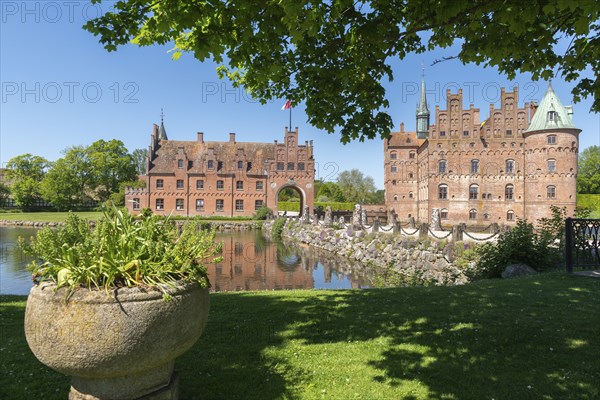Bridge to Egeskov moated castle with gatehouse, KvÃ¦rndrup near Svenborg, Svendburg, reflection,