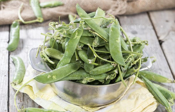 Small portion of fresh harvested Peas (close-up shot)