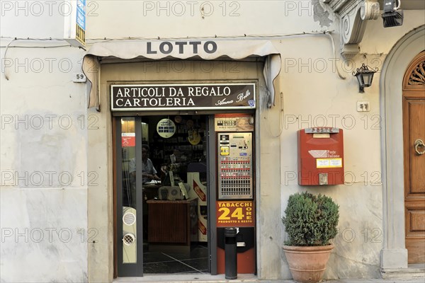 Barberino, Tuscany, Italy, Europe, Small shop with lottery window, door and plant in the entrance