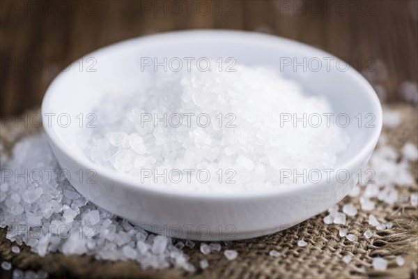 Portion of Coarse Salt on vintage background (selective focus, close-up shot)