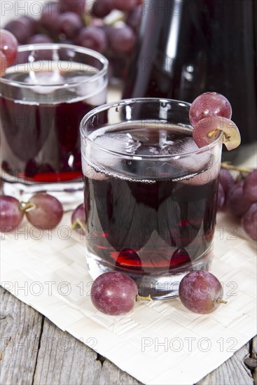 Glass with Grape Juice and fresh fruits