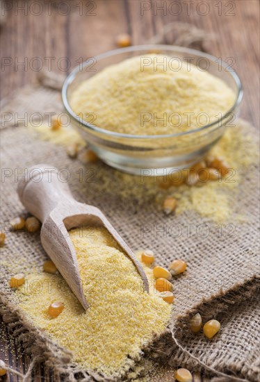 Portion of Cornmeal (on rustic background) as detailed close-up shot