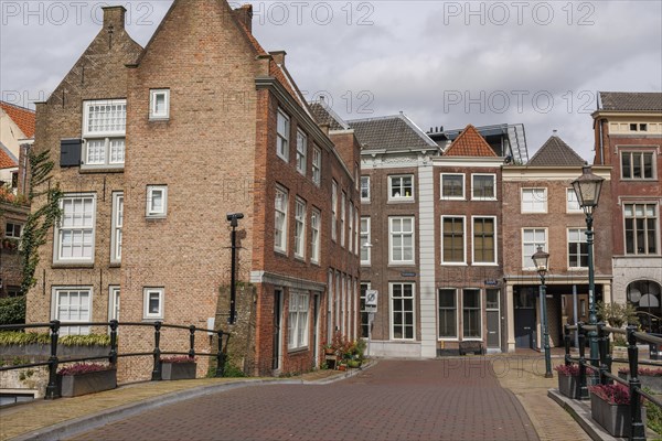 Cobbled streets lined with brick houses with historic facades and street lamps, Dordrecht, holland,