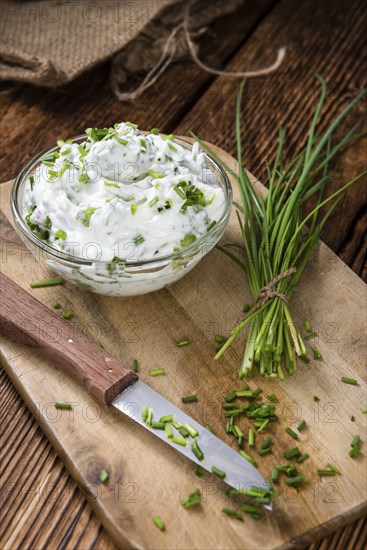 Fresh made Herb Curd (close-up shot) on vintage background