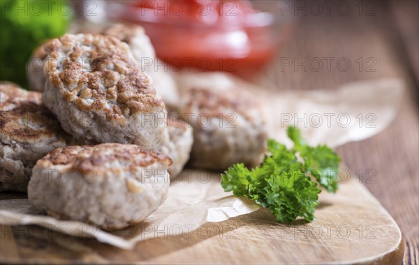 Homemade Meatballs (selective focus) on dark wooden background