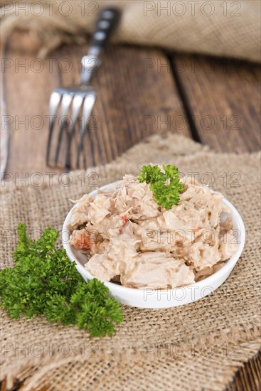 Portion of Tuna salad in a small bowl (close-up shot)