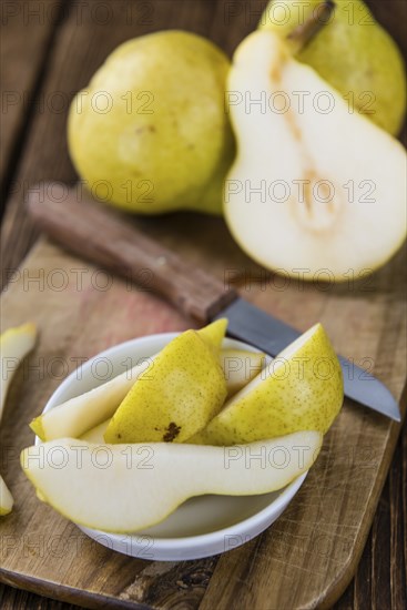 Some fresh Pears (selective focus) on wooden background