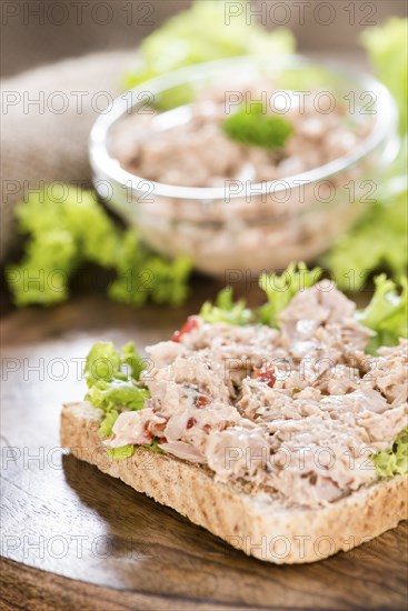 Fresh made Tuna salad sandwich on rustic wooden background