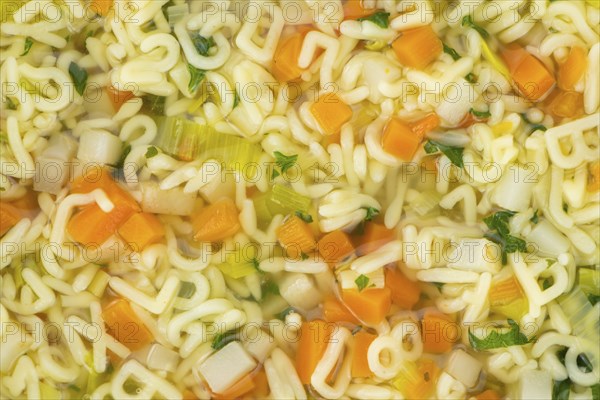Portion of fresh made Alphabet Soup (selective focus, close-up shot)