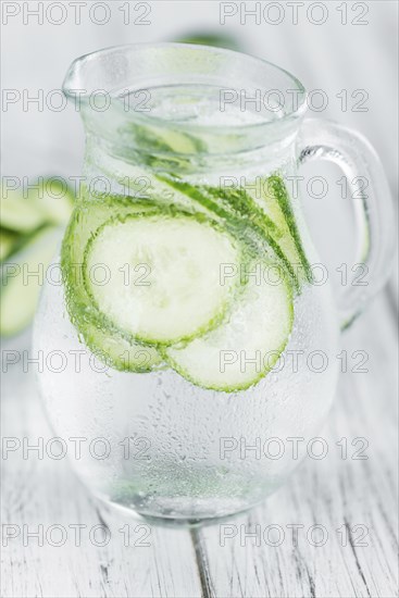 Cucumber Water on a vintage background as detailed close-up shot, selective focus