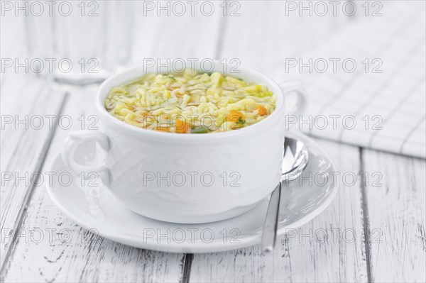 Portion of fresh made Alphabet Soup (selective focus, close-up shot)