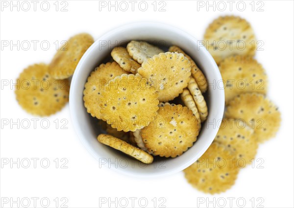 Portion of mixed Snacks isolated on white background (close up shot, selective focus)