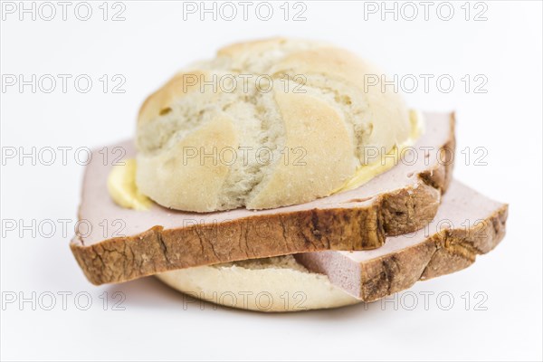 Portion of fresh made Leberkaese isolated on white background