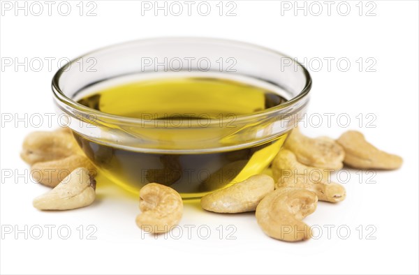 Portion of Cashew Oil isolated on white background (selective focus)