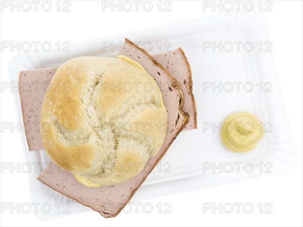 Portion of fresh made Leberkaese isolated on white background