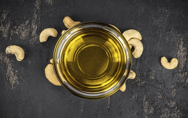 Fresh made Cashew Oil (detailed close up shot, selective focus)